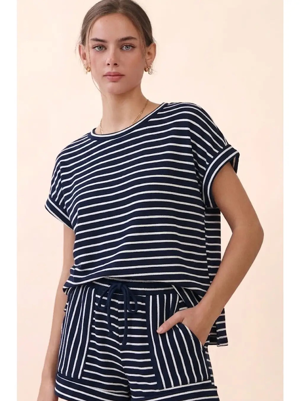 Navy and white striped short sleeve top with rolled sleeves and matching shorts featuring a drawstring waist and side pockets.