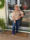 Mocha floral patchwork print button-down top with crochet trim, styled with flared jeans outside a boutique.