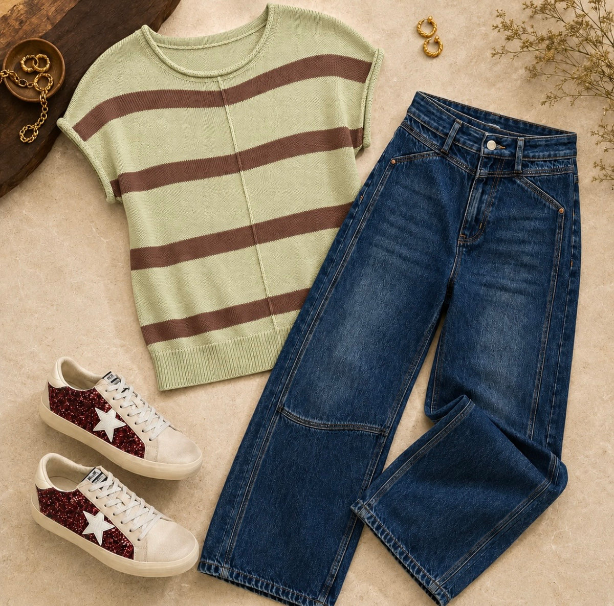 Light olive sweater knit top with horizontal stripes, short sleeves, and front seam detail styled with denim jeans and sneakers.
