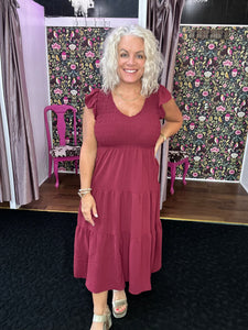 Flutter sleeve smocked dress in burgundy