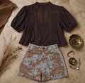 Brown cropped top with lace trim, puff sleeves, and pintuck details, perfect for casual or dressed-up occasions.