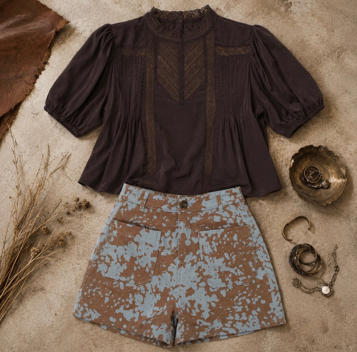 Brown cropped top with lace trim, puff sleeves, and pintuck details, perfect for casual or dressed-up occasions.