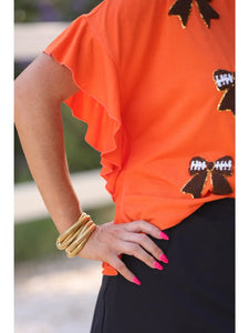 Sideline Sparkle Ruffle Top in orange