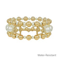 Stretch bracelets with gold-tone and pearl-like beads, featuring a horse bit charm and water-resistant design.