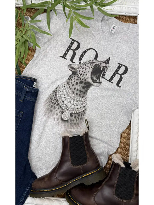 Gray graphic t-shirt featuring a roaring cheetah with rhinestones and the text 'ROAR' above the design.